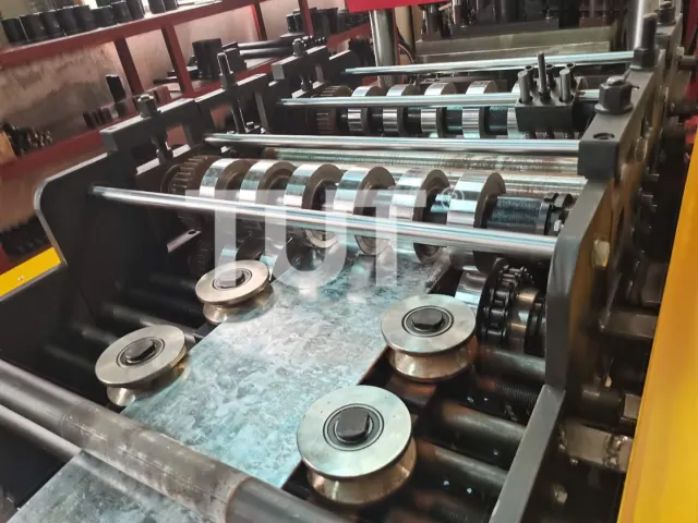 Roll forming stations with a light gauge strip being formed into a channel profile