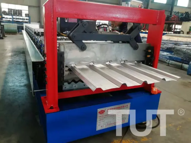 Roll forming line producing corrugated and trapezoidal roof panels