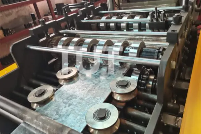 Forming rolls and shafts on a cold roll forming machine, cut to a specific profile drawing